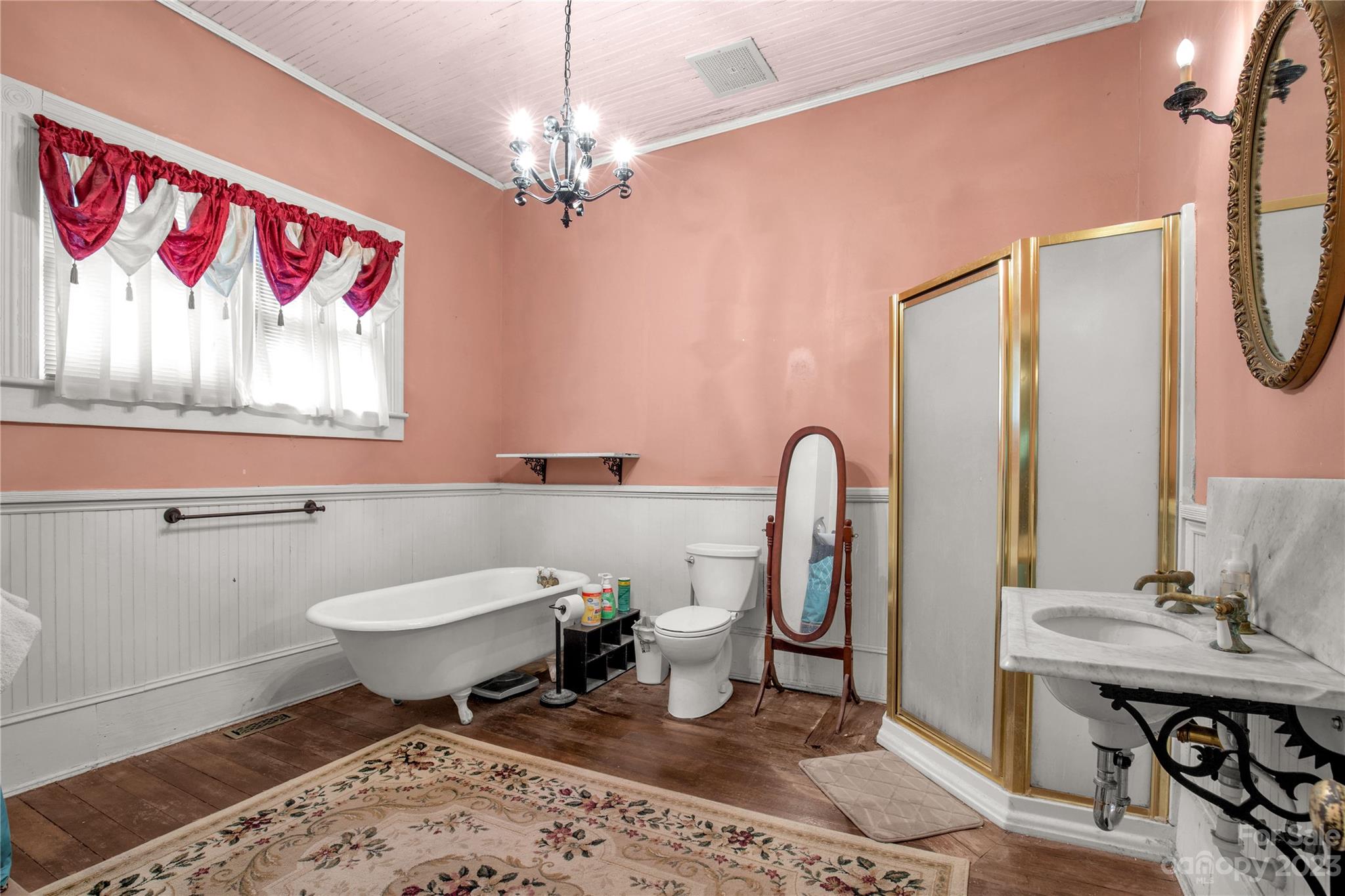 205 Walnut Street Chester, SC 29706 - Photo 20 of 32 a spacious bathroom with a toilet a sink and a mirror