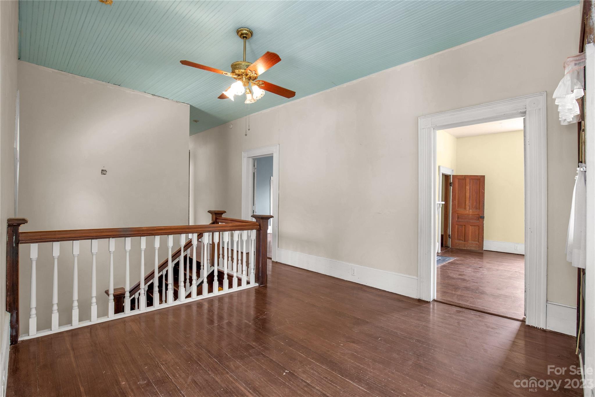 205 Walnut Street Chester, SC 29706 - Photo 24 of 32 a view of a hallway with wooden floor and stairs