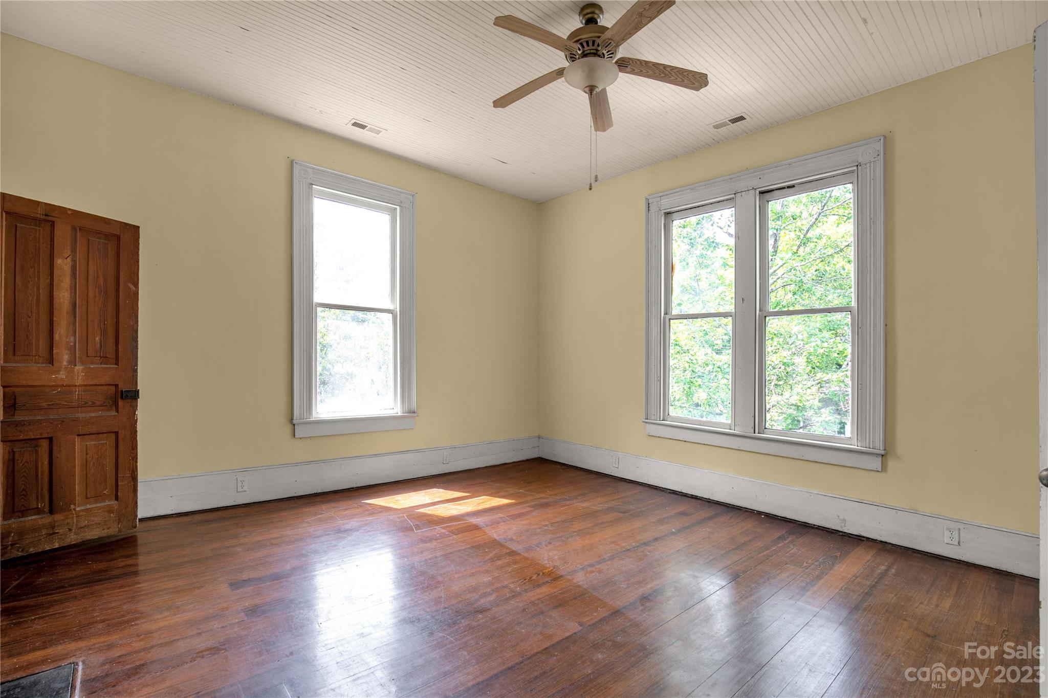 205 Walnut Street Chester, SC 29706 - Photo 25 of 32 a view of an empty room with wooden floor and a window
