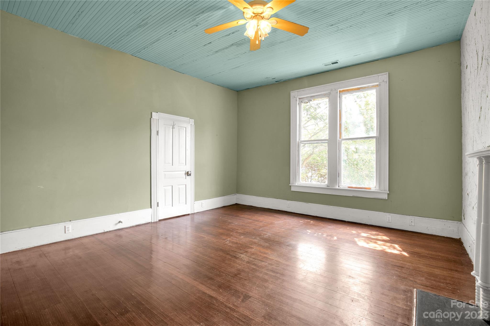 205 Walnut Street Chester, SC 29706 - Photo 27 of 32 a view of an empty room with window and wooden floor