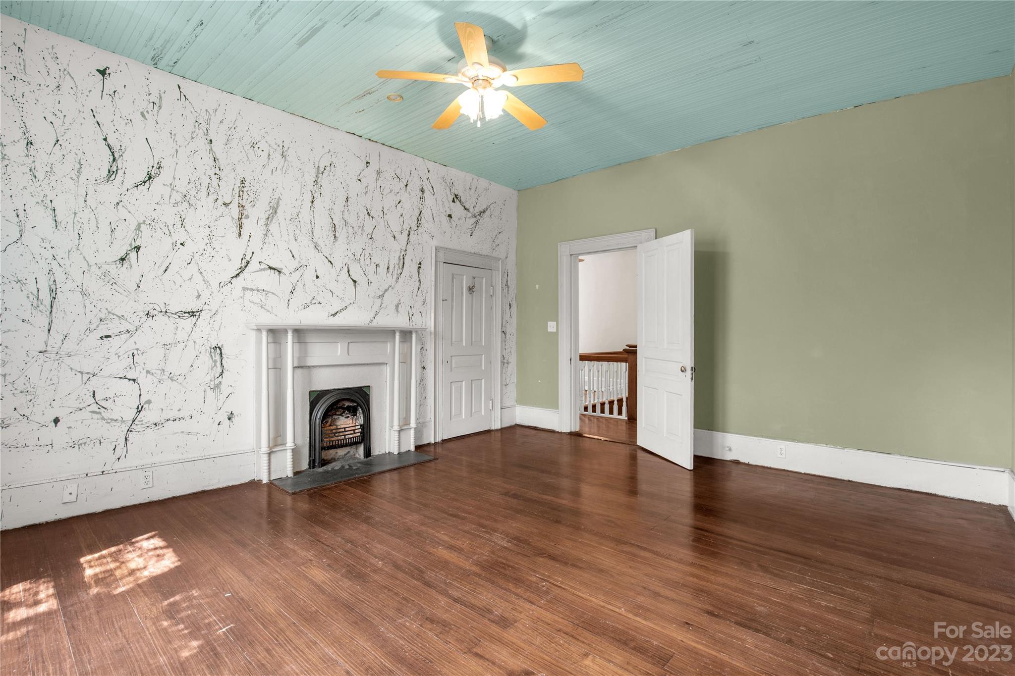 205 Walnut Street Chester, SC 29706 - Photo 28 of 32 a view of empty room with wooden floor and fireplace