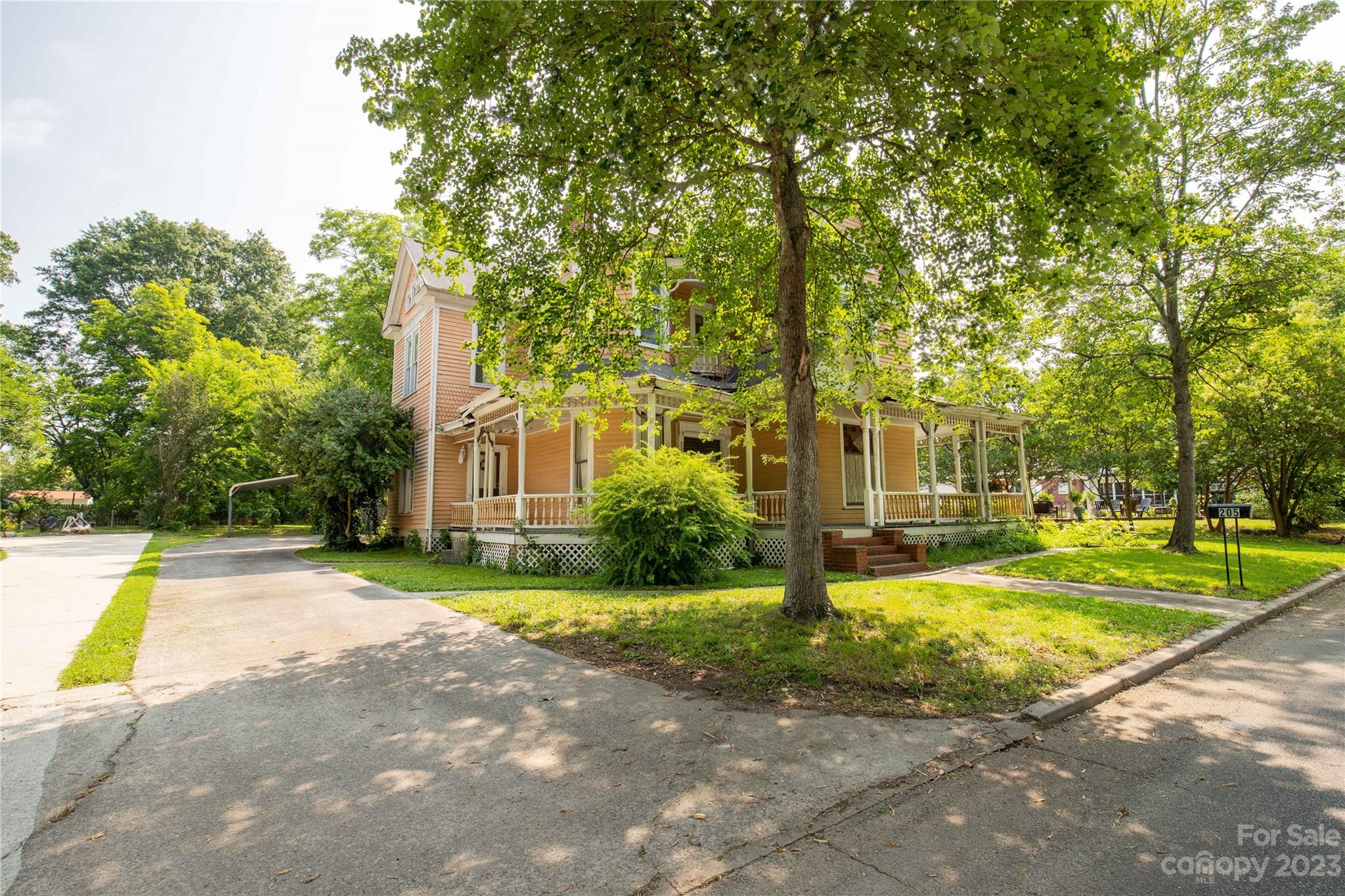 205 Walnut Street Chester, SC 29706 - Photo 3 of 32 a view of a house with swimming pool and trees in the background