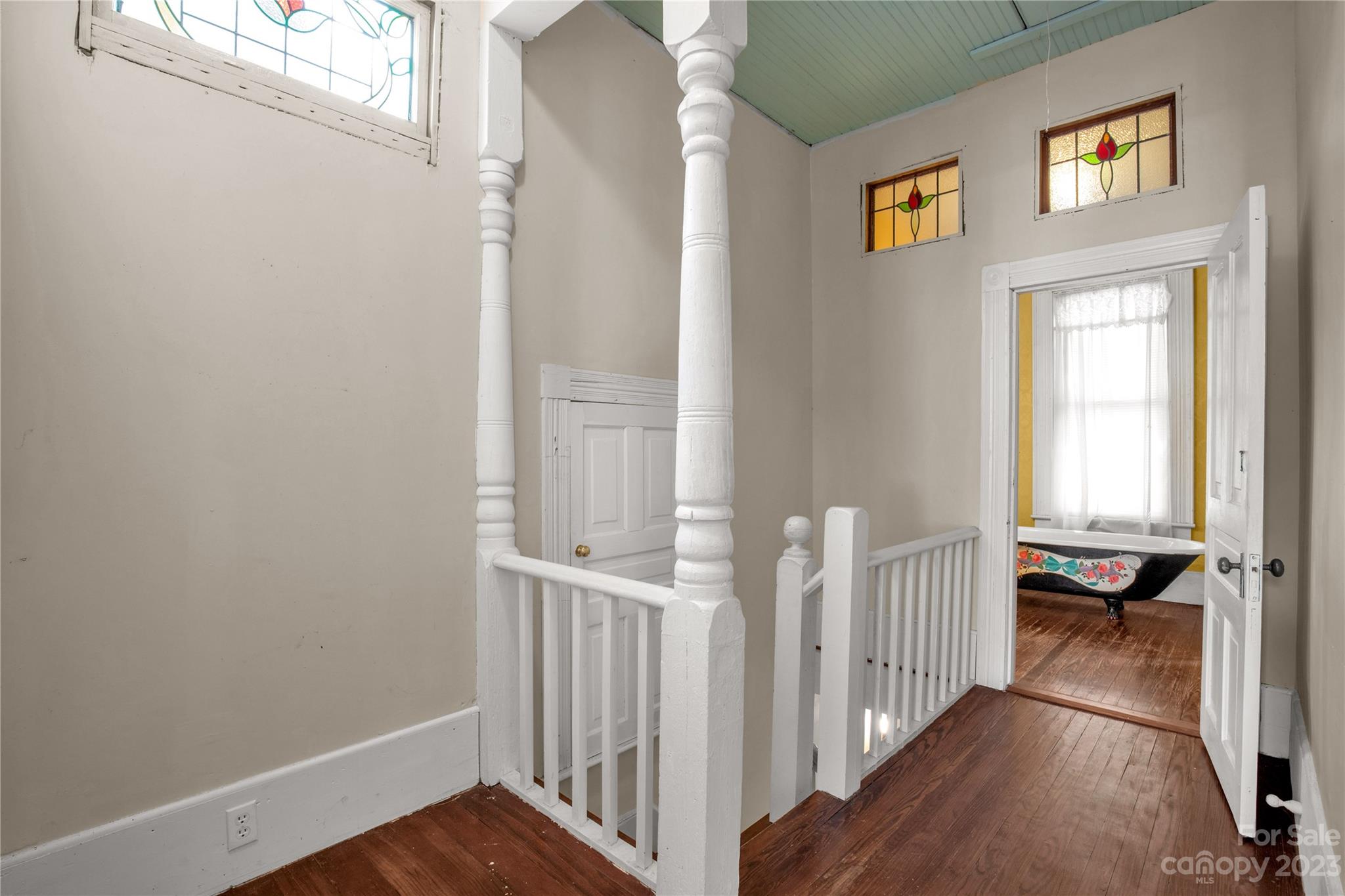 205 Walnut Street Chester, SC 29706 - Photo 31 of 32 a view of a hallway to a livingroom with wooden floor and windows