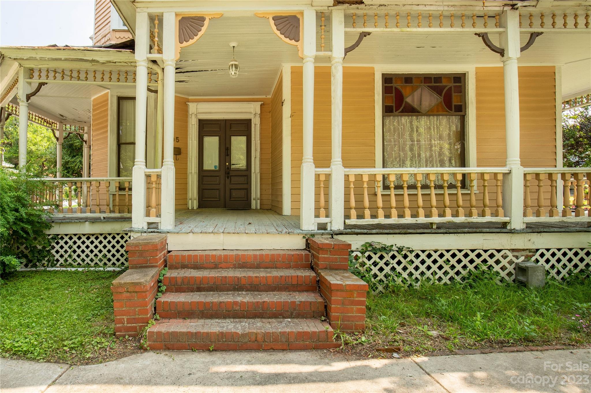 205 Walnut Street Chester, SC 29706 - Photo 4 of 32 a view of a brick house with a large window