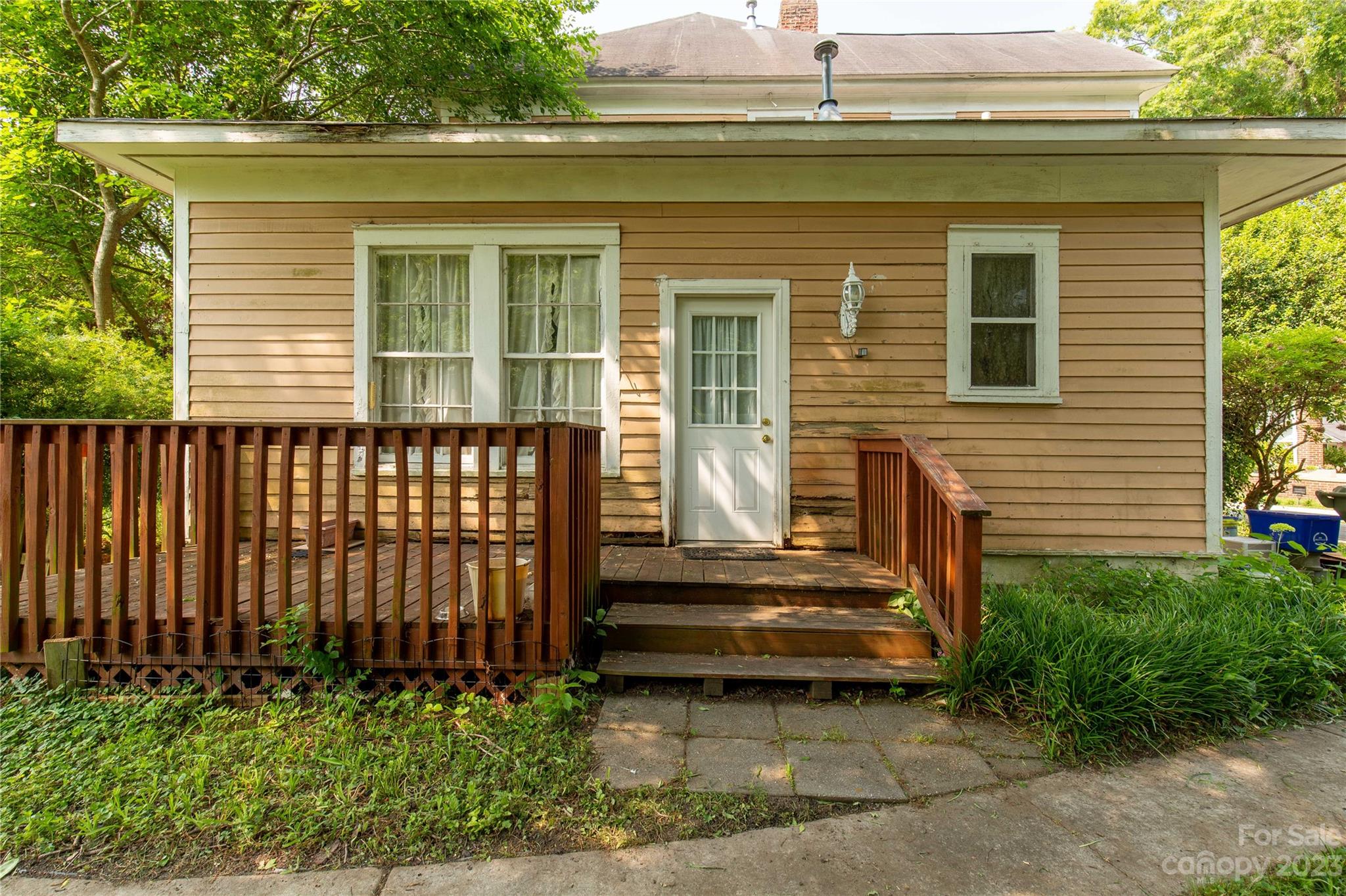205 Walnut Street Chester, SC 29706 - Photo 10 of 32 a view of a house with a small yard and plants