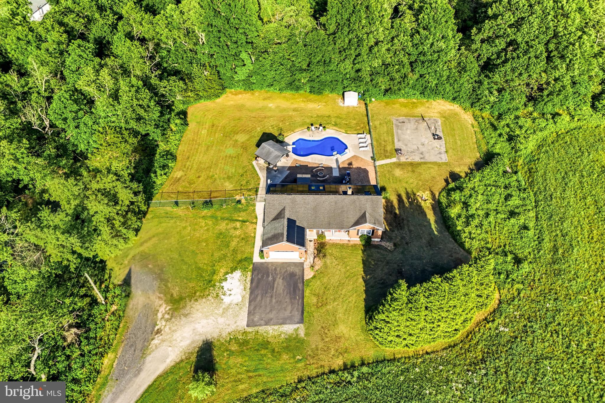 705 Garden Road Pittsgrove, NJ 08318 - Photo 6 of 72 a view of a swimming pool with a yard