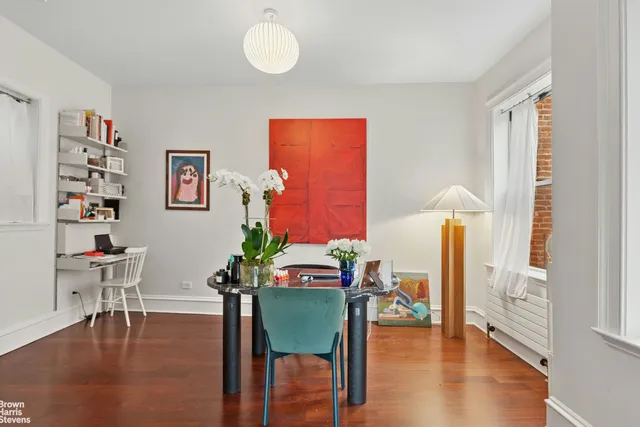 a bed room with a bed and a window