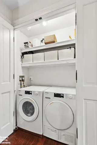 a view of an entryway with wooden floor