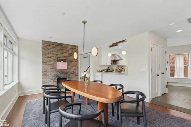 a bedroom with furniture and a book shelf