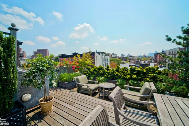 a bedroom with furniture and a fireplace