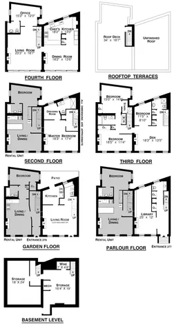 a view of a brick house with many windows and a tree