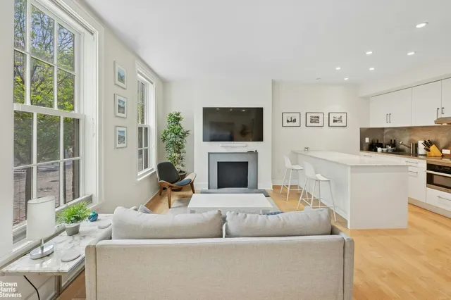 a kitchen with a sink a stove and cabinets