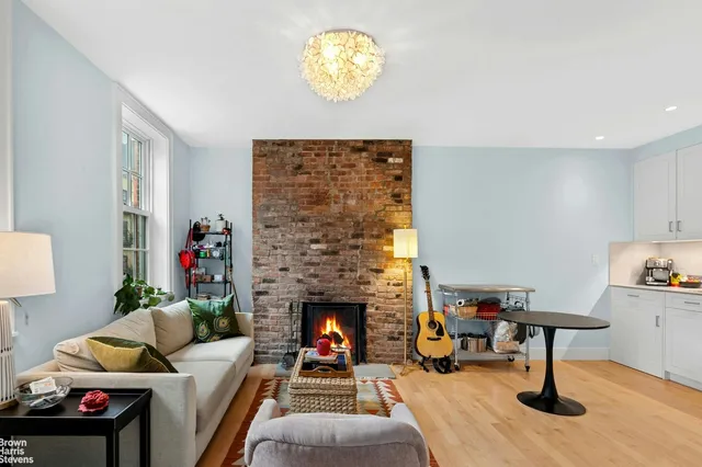 a living room with furniture windows and a fireplace