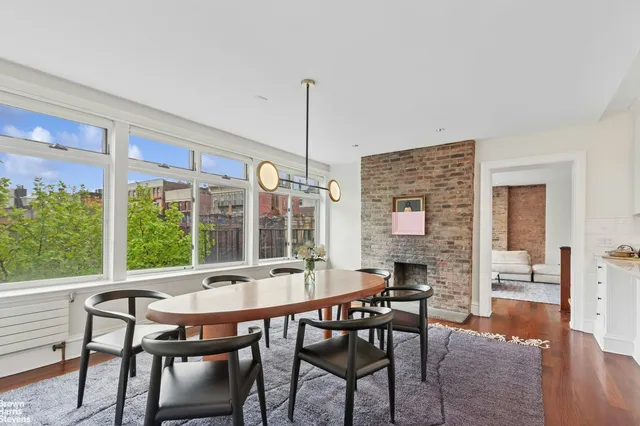 a kitchen with granite countertop a sink stainless steel appliances and cabinets