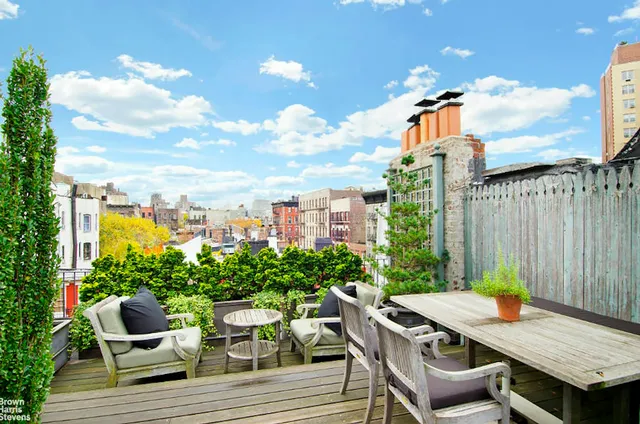 a bedroom with furniture and a fireplace