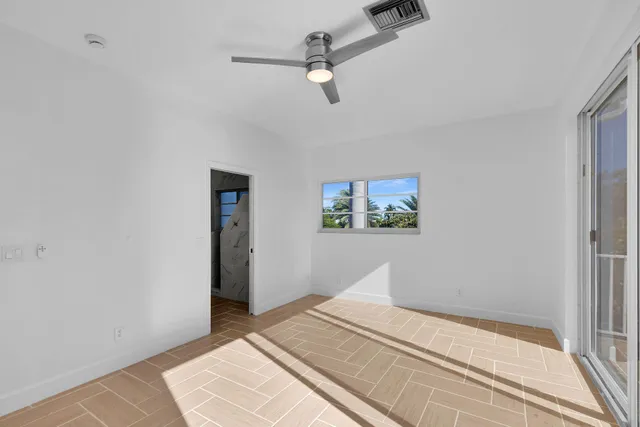 a spacious bathroom with a double vanity sink mirror and double