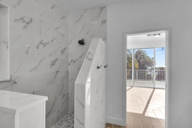 an aerial view of a house with a yard and a fountain