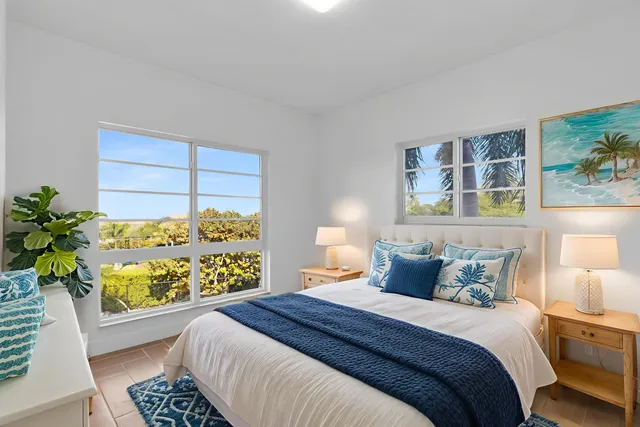an aerial view of a house with a garden and trees