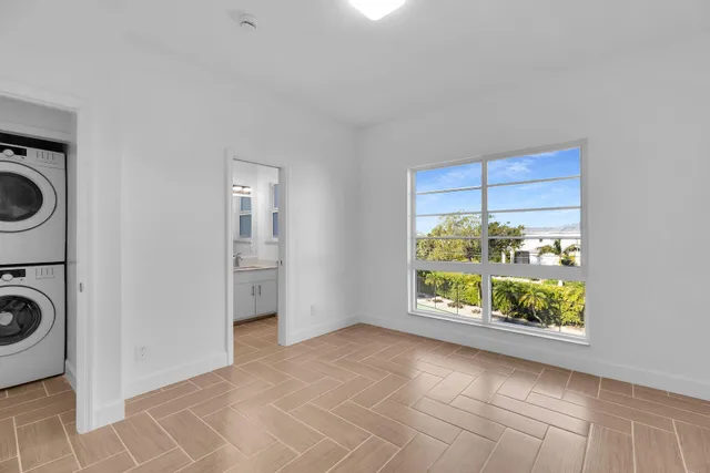 an aerial view of multiple houses with a yard