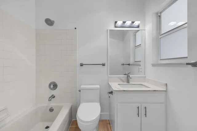 an aerial view of a house with a garden and swimming pool