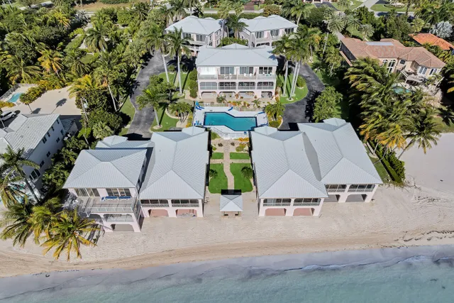 a view of a house with sitting area and swimming pool