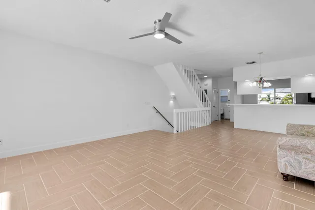 a view of a balcony with wooden floor