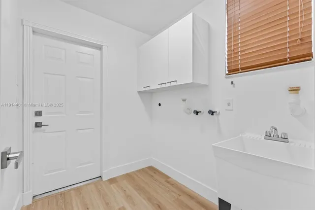 a bathroom with a sink and a window