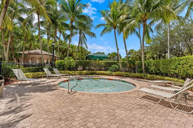 a view of a livingroom with furniture and a floor to ceiling window
