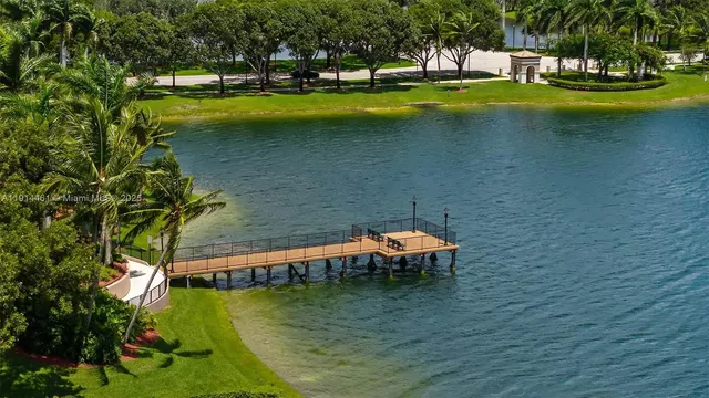 a view of a swimming pool with an outdoor space and seating area