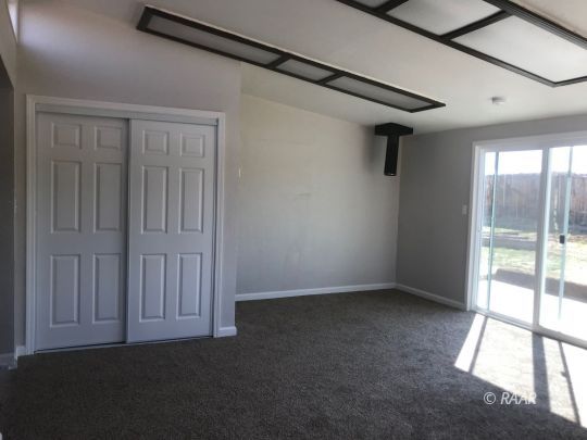 1505 South McCall Street Ridgecrest, CA 93555 - Photo 9 of 17 a view of an empty room with a window