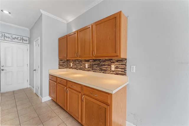 a kitchen with a sink cabinets and a refrigerator
