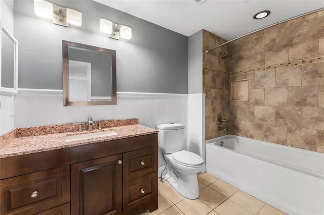 a bathroom with a sink a toilet and a bathtub