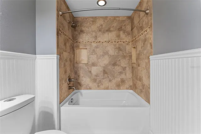 a bathroom with a bath tub and a shower