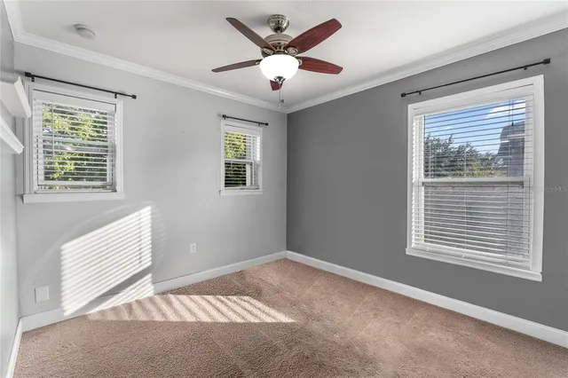 a view of an empty room with a window