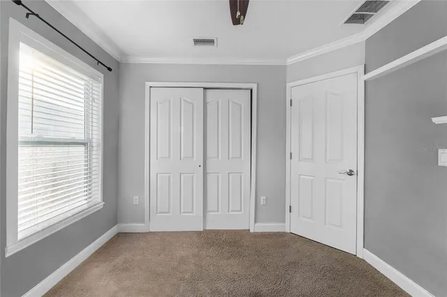 a view of an empty room with a window