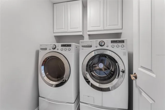 a utility room with dryer and washer