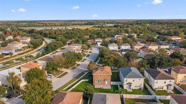 an aerial view of residential houses with outdoor space