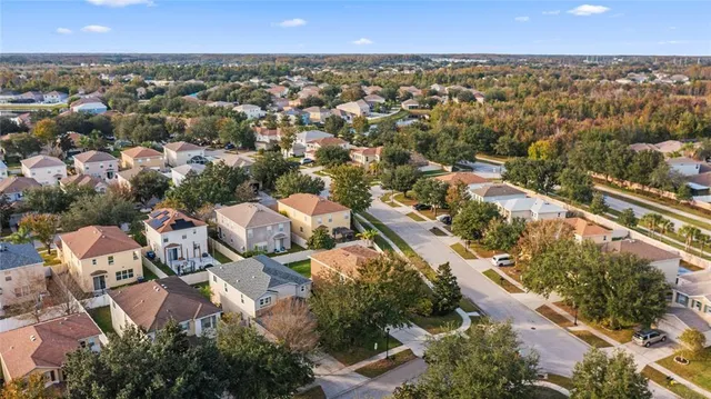 an aerial view of residential houses with outdoor space