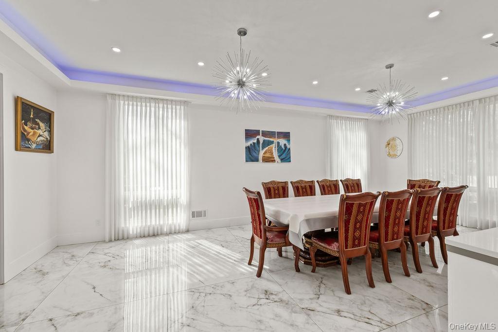 5 Bluebird Road Monsey, NY 10952 - Photo 15 of 50 a view of a dining room with furniture and chandelier