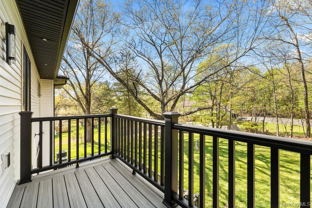 5 Bluebird Road Monsey, NY 10952 - Photo 22 of 50 a view of wooden balcony with a trees