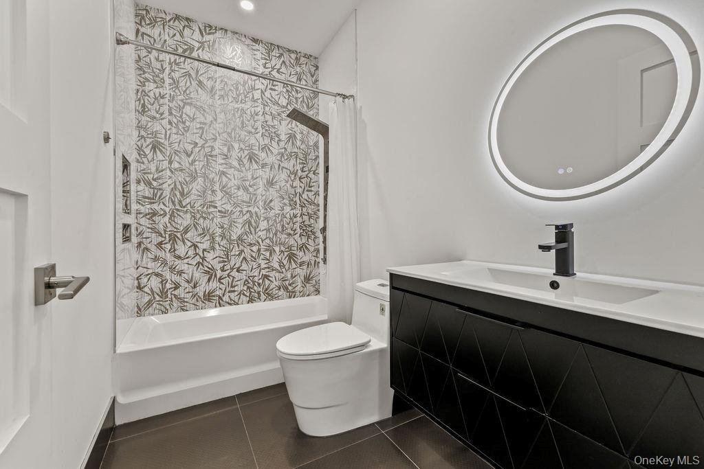5 Bluebird Road Monsey, NY 10952 - Photo 25 of 50 a bathroom with a sink a toilet and a mirror