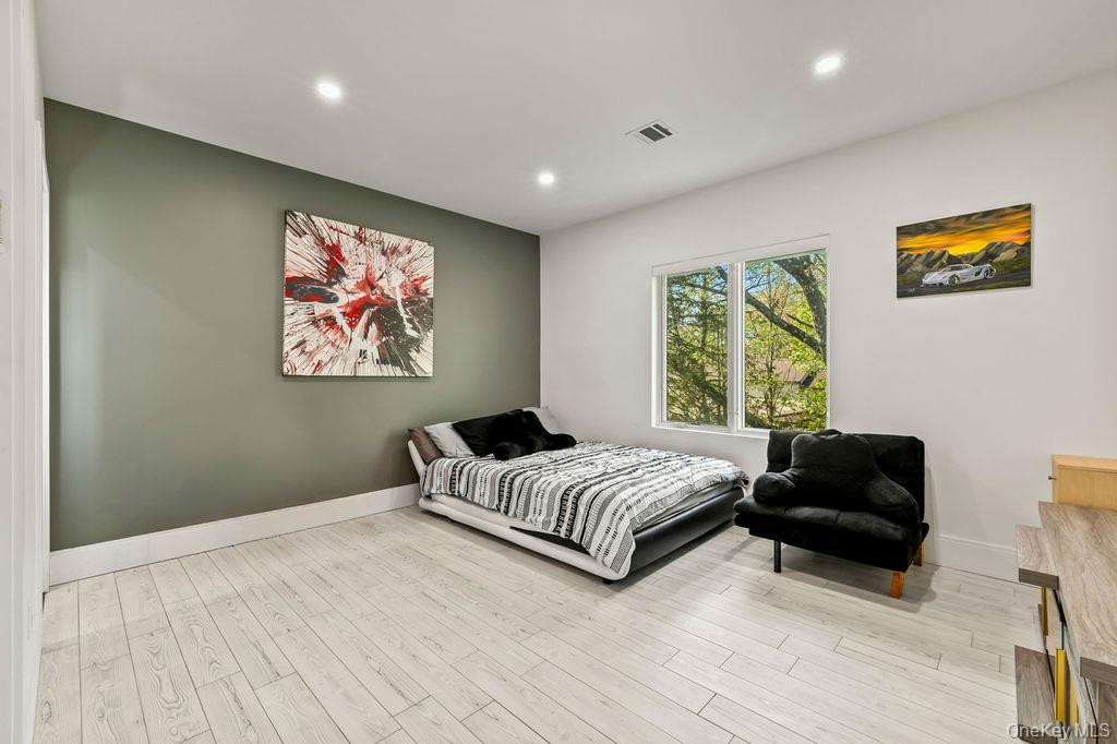 5 Bluebird Road Monsey, NY 10952 - Photo 27 of 50 a bedroom with a bed and a couch