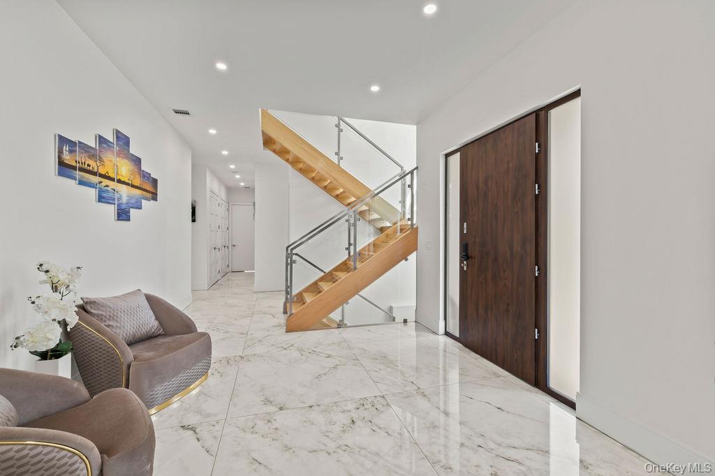 5 Bluebird Road Monsey, NY 10952 - Photo 5 of 50 a living room with furniture and stairs