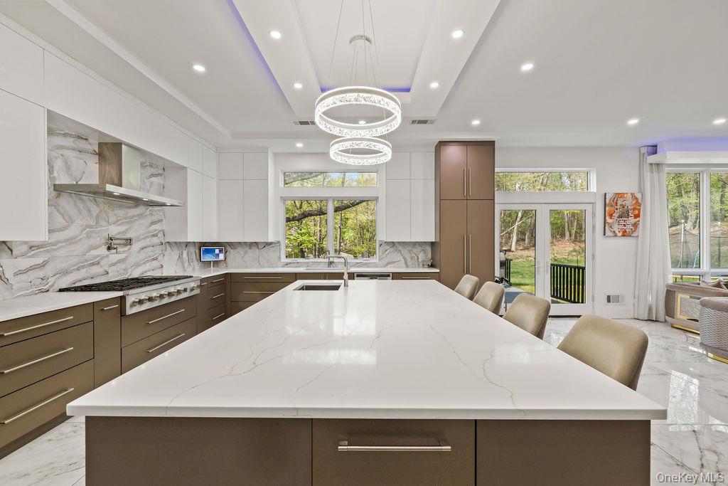 5 Bluebird Road Monsey, NY 10952 - Photo 9 of 50 a large white kitchen with a large window