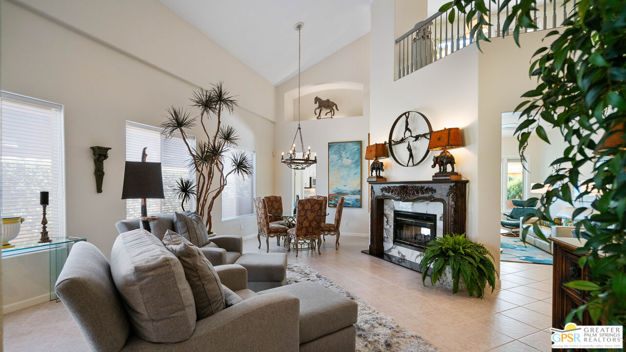 72 North Kavenish Drive Rancho Mirage, CA 92270 - Photo 11 of 73 a living room with furniture and a fireplace