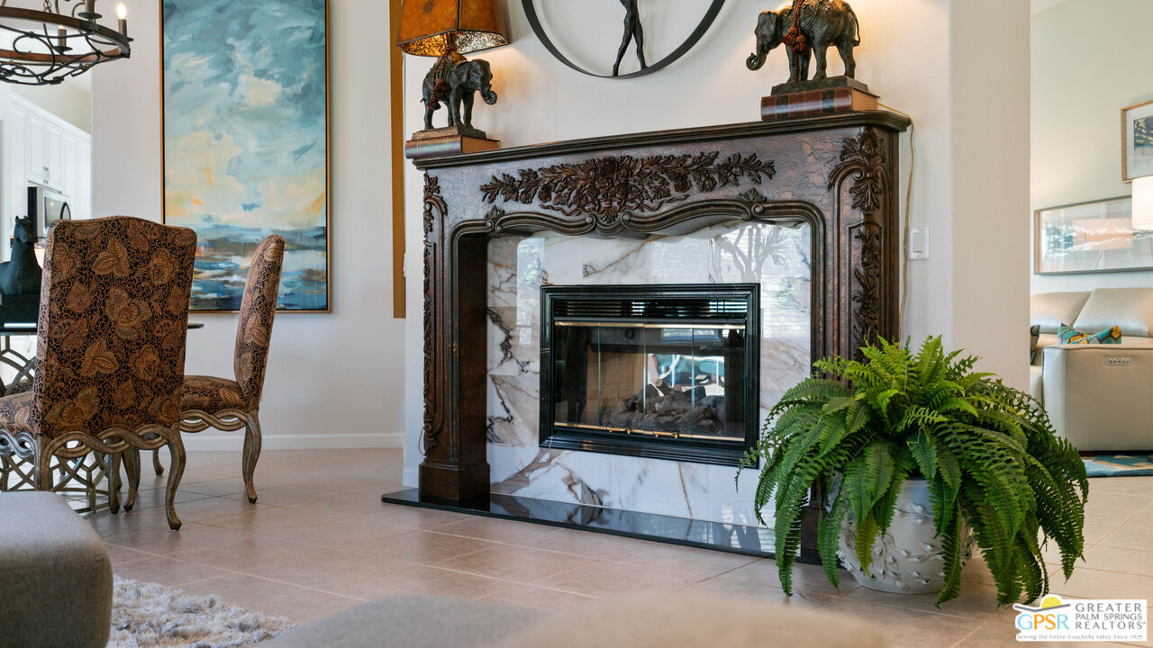 72 North Kavenish Drive Rancho Mirage, CA 92270 - Photo 14 of 73 a living room with furniture and a fireplace