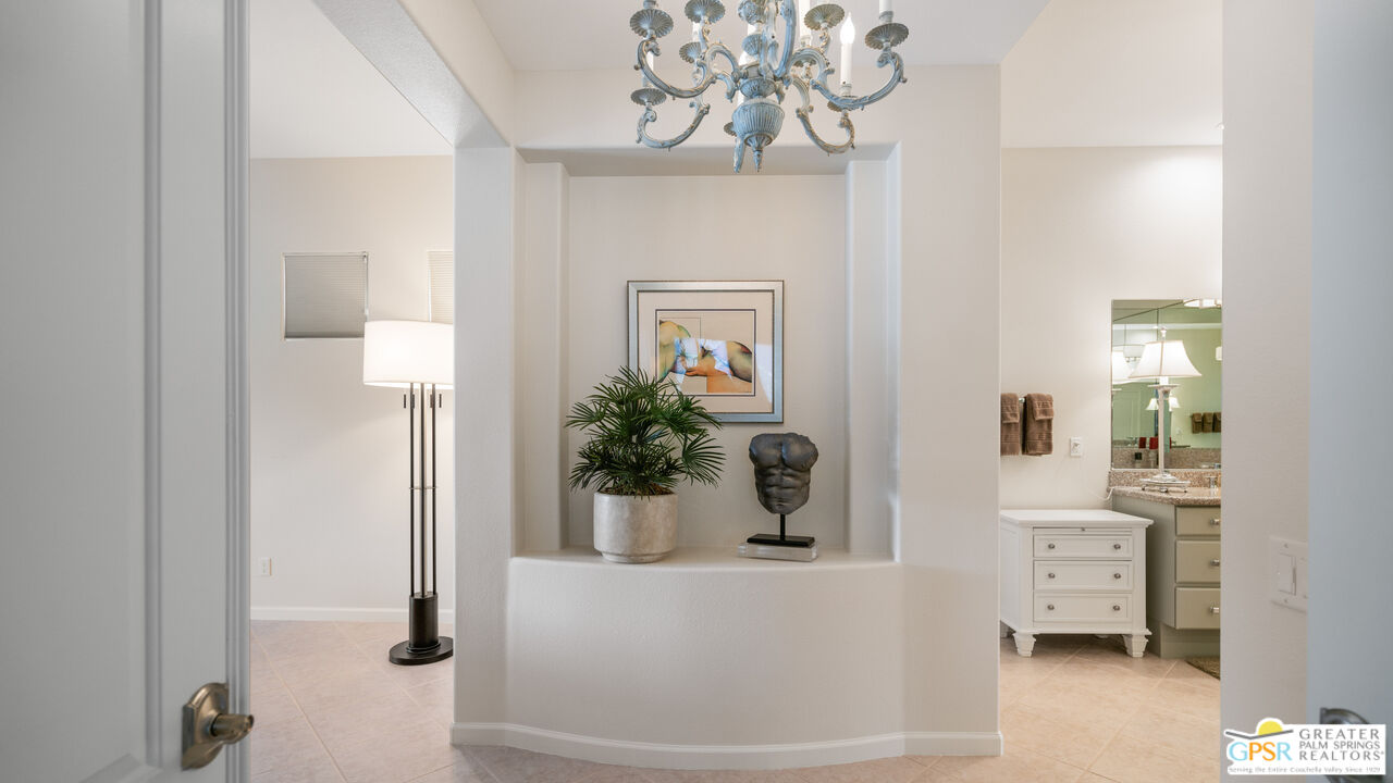 72 North Kavenish Drive Rancho Mirage, CA 92270 - Photo 20 of 73 a view of spacious bathroom with a potted plant on the counter and mirror