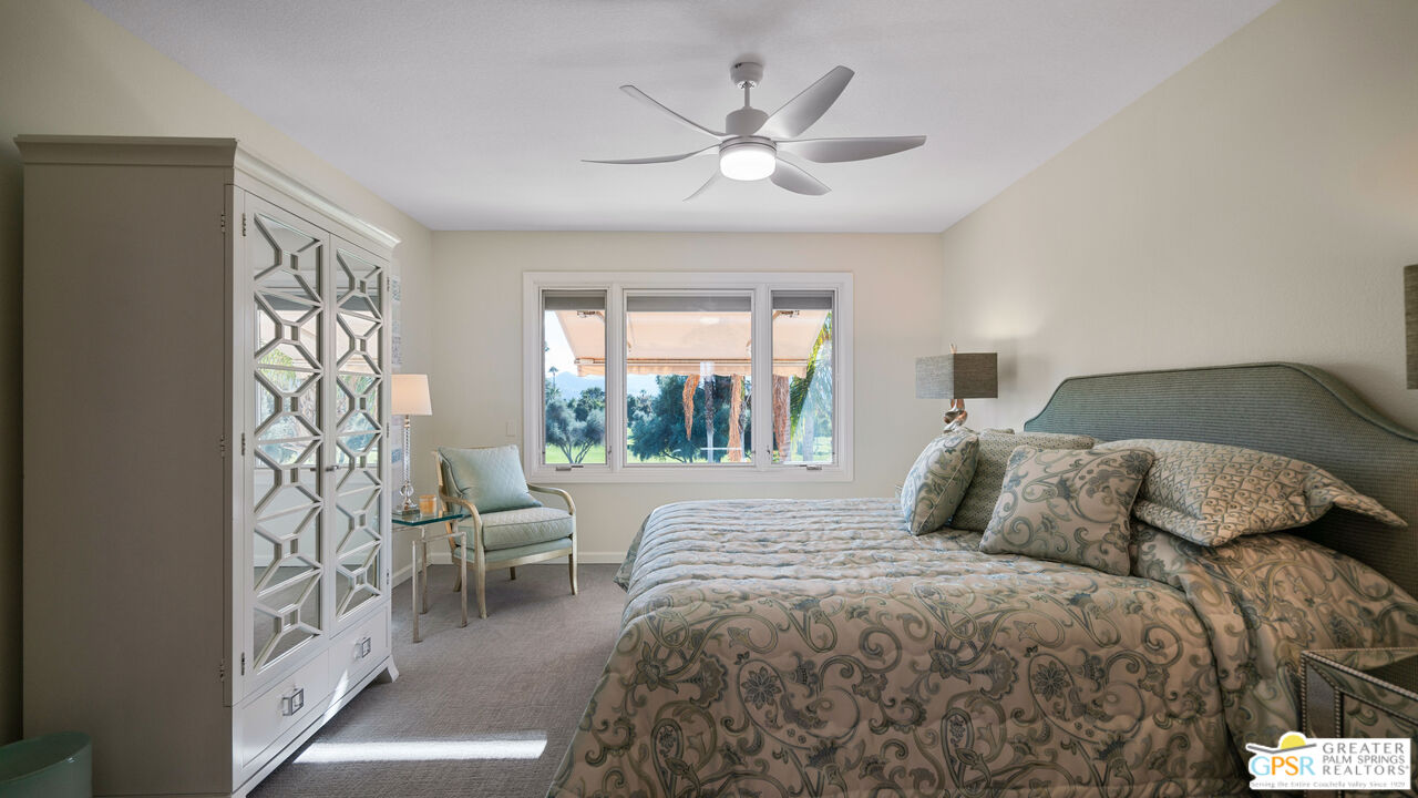72 North Kavenish Drive Rancho Mirage, CA 92270 - Photo 36 of 73 a bedroom with a large bed and a window