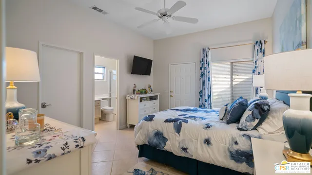a view of patio with table and chairs under an umbrella