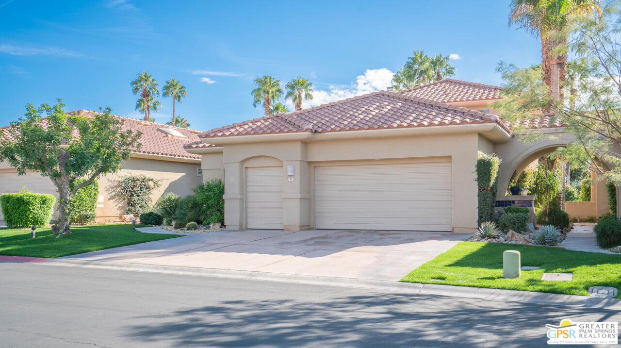 72 North Kavenish Drive Rancho Mirage, CA 92270 - Photo 52 of 73 a front view of a house with a yard and garage